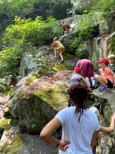 Children climb rocks 