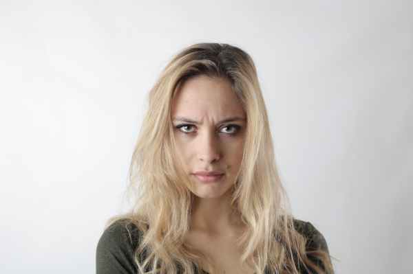 portrait photo of woman frowning
